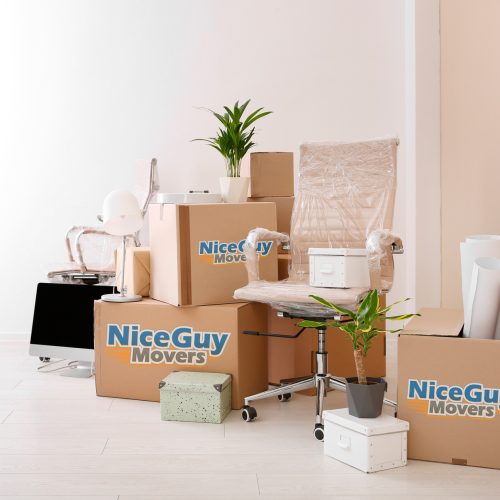 cardboard box with paper and office supplies on the floor during the move
